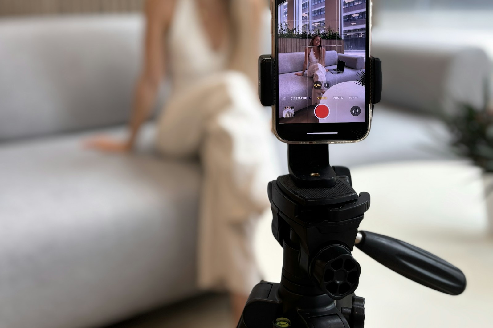 Smartphone on a tripod filming vertical video of a subject, short-form and social media video production for brands
